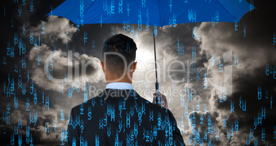 Composite image of rear view of businessman carrying blue umbrella