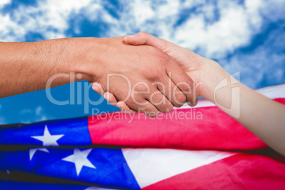 Composite image of man and woman doing handshake