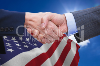 Composite image of businessman and woman doing handshake