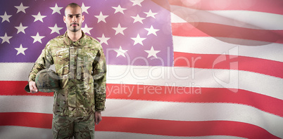 Composite image of portrait of confident soldier with helmet