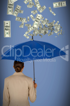 Composite image of rear view of businesswoman carrying blue umbrella