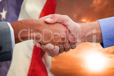 Composite image of male colleagues shaking hands