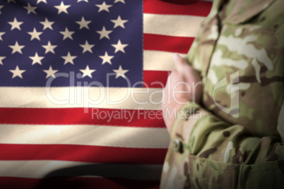 Composite image of mid section of military soldier taking oath