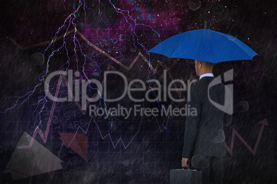 Composite image of rear view of businessman holding blue umbrella and briefcase