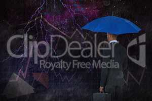 Composite image of rear view of businessman holding blue umbrella and briefcase