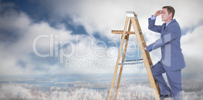 Composite image of businessman looking away while climbing on ladder