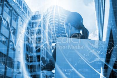 Composite image of rear view of businesswoman using mobile while sitting on chair