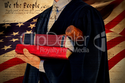 Composite image of lawyer holding scales of justice