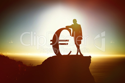 Composite image of silhouette beside euro symbol