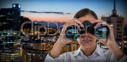 Composite image of close up of businesswoman looking through binoculars