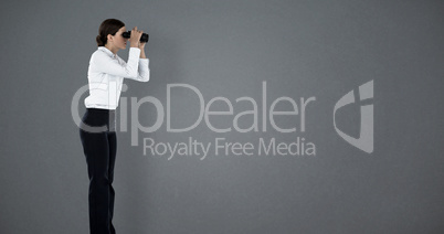 Composite image of side view of businesswoman looking through binoculars