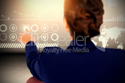 Composite image of rear view of businesswoman working on white background