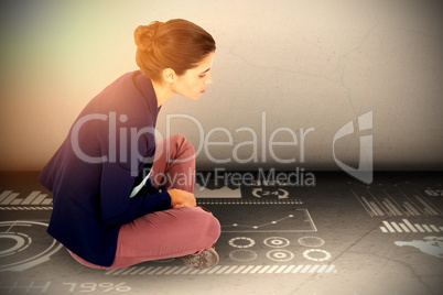 Composite image of businesswoman sitting on white background