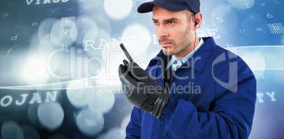 Composite image of focused security officer talking on walkie talkie