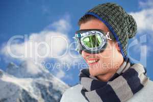 Composite image of happy young man wearing aviator goggles against white background