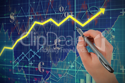 Composite image of businesswomans hand writing with pen