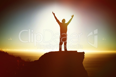 Composite image of businessman standing with arms outstretched