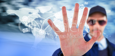 Composite image of confident security officer making stop gesture