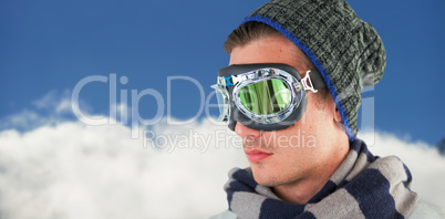 Composite image of young man wearing aviator goggles against white background