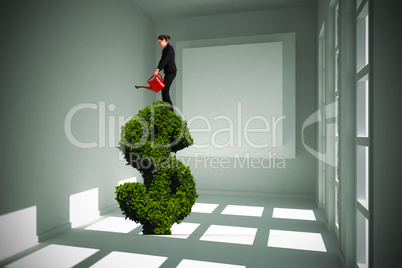 Composite image of businesswoman using red watering can