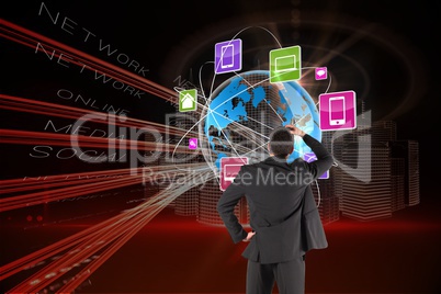 Businessman watching digital world in black background