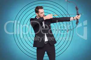 Businessman playing archery in blue background