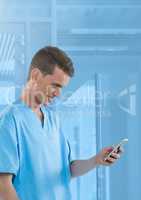 Doctor smiling at mobile phone in blue modern space