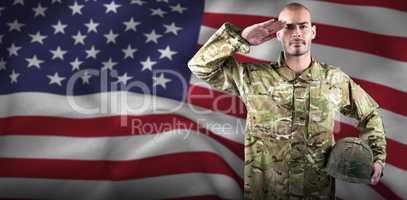 Composite image of portrait of confident soldier holding helmet while saluting