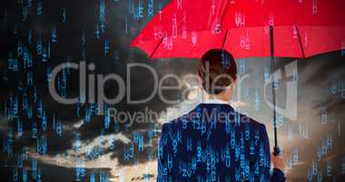 Composite image of rear view of businesswoman holding red umbrella