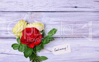 bouquet of blossoming roses with a paper tag