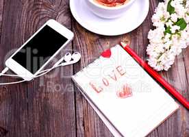Paper notepad with the inscription love