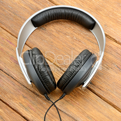 Big headphones on wooden table