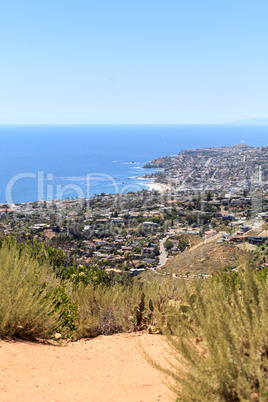 High hillside view of coastline of Laguna Beach with the ocean