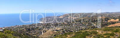 High hillside view of coastline of Laguna Beach with the ocean