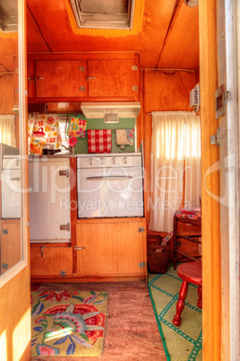 Small retro caravan camper used as a tiny house on road trips