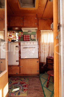 Small retro caravan camper used as a tiny house on road trips