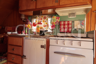 Small retro caravan camper used as a tiny house on road trips