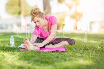 Young Fit Flexible Adult Woman Outdoors on The Grass With Yoga M