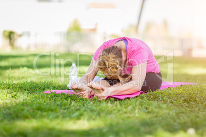 Young Fit Flexible Adult Woman Outdoors on The Grass With Yoga M