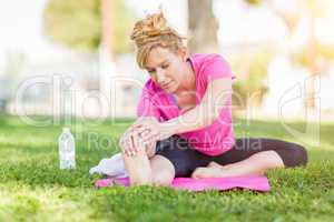 Young Fit Flexible Adult Woman Outdoors on The Grass With Yoga M