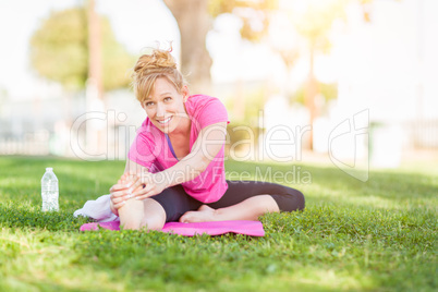 Young Fit Flexible Adult Woman Outdoors on The Grass With Yoga M