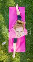 Overhead of Young Fit Flexible Adult Woman Outdoors on The Grass