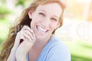 Outdoor Portrait of Young Adult Brown Eyed Woman.