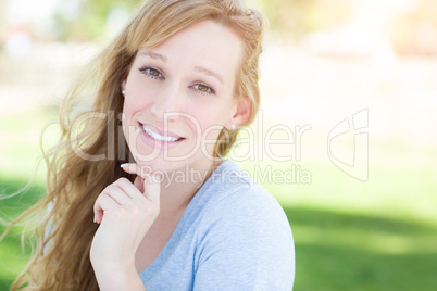 Outdoor Portrait of Young Adult Brown Eyed Woman.