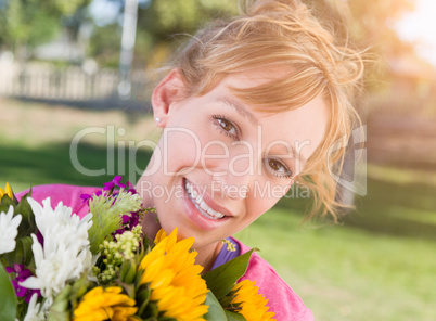 Outdoor Portrait of an Excited Young Adult Brown Eyed Woman Hold