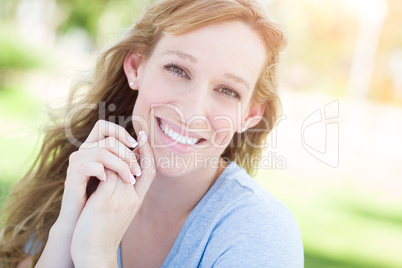 Outdoor Portrait of Young Adult Brown Eyed Woman.