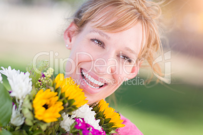 Outdoor Portrait of an Excited Young Adult Brown Eyed Woman Hold