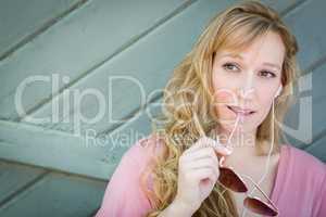 Outdoor Portrait of Young Adult Brown Eyed Woman With Sunglasses