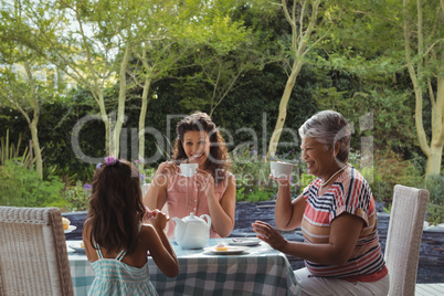 Happy family having tea