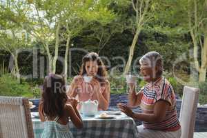 Happy family having tea